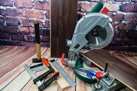 Tools for laying wooden laminate or parquet on the floorの写真素材