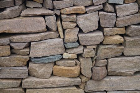 Wall of bricks or stones and fugues