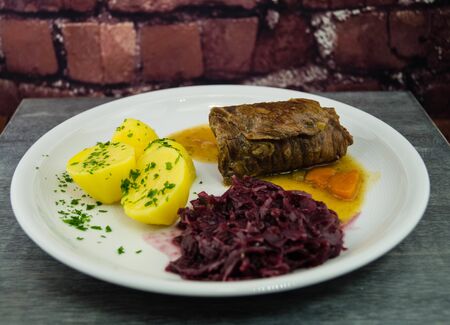 Traditional german food beef roulade with red cabbageの写真素材