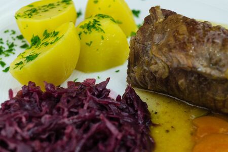 Traditional german food beef roulade with red cabbageの写真素材