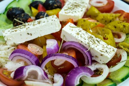 Greek salad with feta cheese olives and hot peppersの写真素材