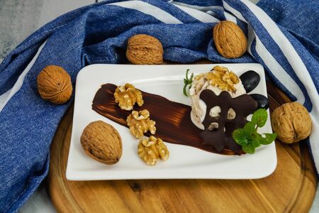 Walnut ice cream with chocolate for dessert