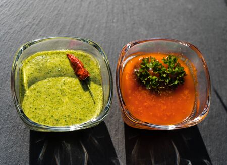 Red and green garlic sauce for canarian potatoesの写真素材