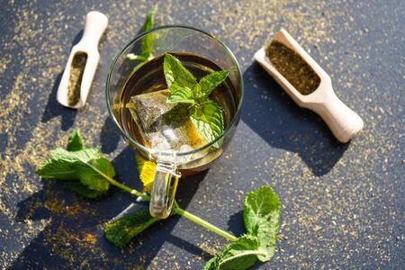 Teatime with green Fresh Peppermint leaves Mentha piperitaの写真素材