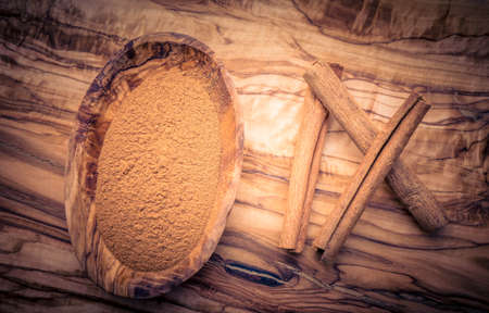 dried cinnamon sticks and powderの写真素材