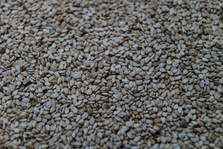 white sesame seeds on olivewood