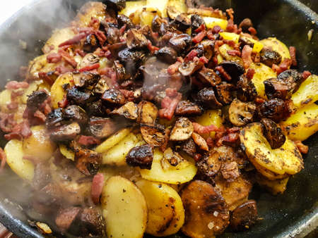 fried fillet steak with potatoes and mushrooms
