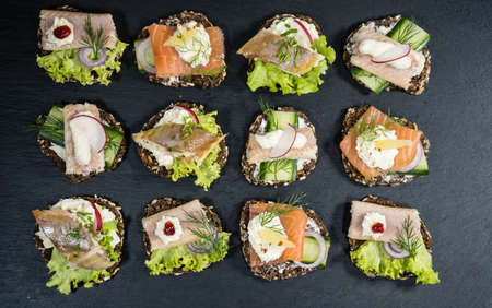Canapes with smoked fish and salad