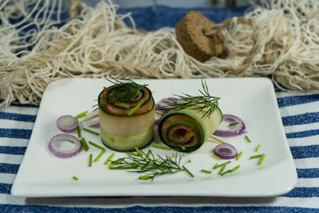 A roll of cucumber and smoked Salmonの写真素材