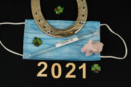 happy new year good luck and stay healthy - corona mask and lucky charms