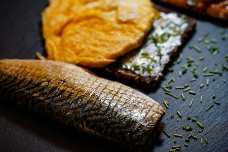 Bread with eggs and smoked mackerel fillet