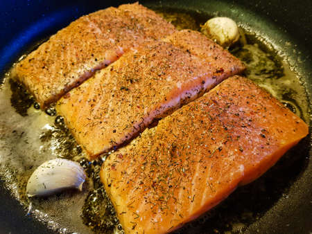 grilled salmon with herbs and spicesの写真素材