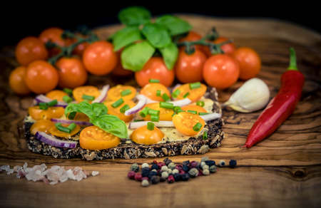 orange cocktail Tomatoes Solanum Lycopersicum with olive oil herbs and spicesの写真素材
