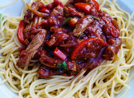 Italian cuisine with basil tomatoes and pastaの写真素材