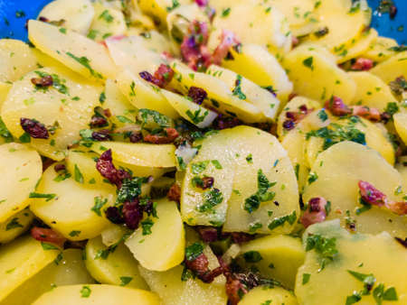 Bacon Potato salad with parsley and chivesの写真素材