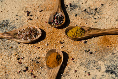 various herbs abd spices on olive woodの写真素材