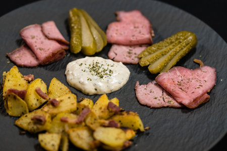 Roast beef with fried potatoes and remoulade sauceの写真素材