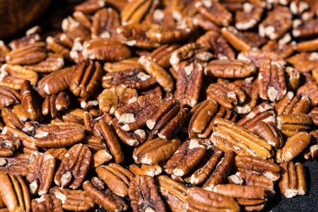 fresh pecans on olive woodの写真素材