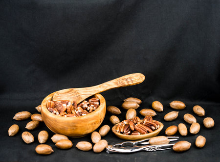 fresh pecans on olive wood