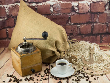 roasted coffee beans and a vitage coffee grinderの写真素材