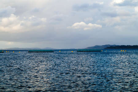 With a cruise ship in the fjords of norwayの写真素材
