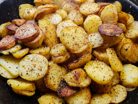 Farmers Breakfast with ham eggs and fried potatoesの写真素材