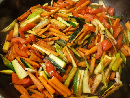 Different kind of vegetables in a frying panの写真素材
