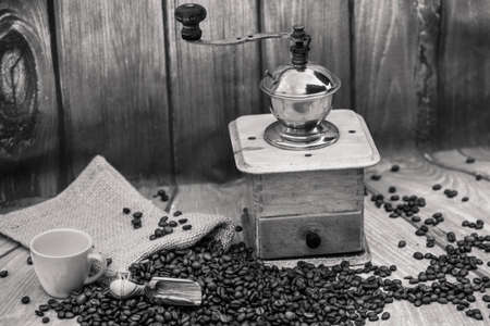 roasted coffee beans and a vintage coffee grinder