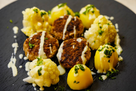 Fried meatballs with boiled cauliglower and parsley potatoes