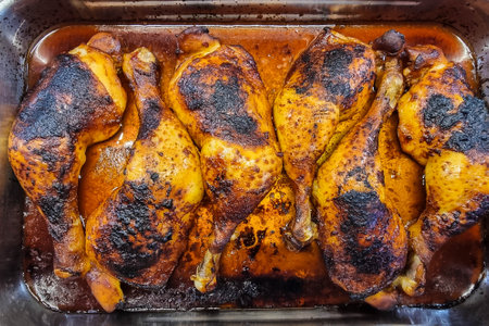 Spicy chicken drumsticks with french friesの写真素材