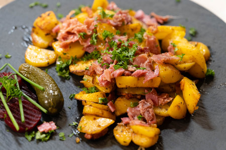 Farmers Breakfast with ham eggs and fried potatoesの写真素材