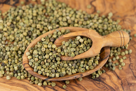 fresh hot pepper on olive woodの写真素材