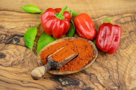 fresh hot pepper on olive woodの写真素材