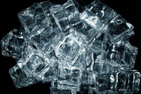 diffuse light shines on a handful of ice cubesの写真素材