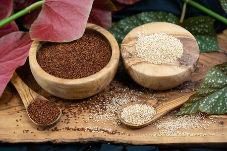 Chenopodium quinoa red or white seed on a wooden tableの写真素材