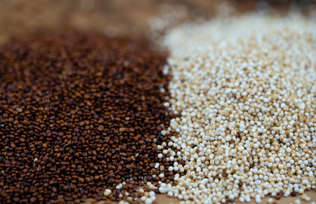 Chenopodium quinoa red or white seed on a wooden tableの写真素材