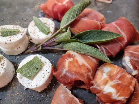 Goat cheese and sage wrapped in a slice of smoked hamの写真素材