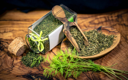 Dill Anethum graveolens on olive woodの写真素材