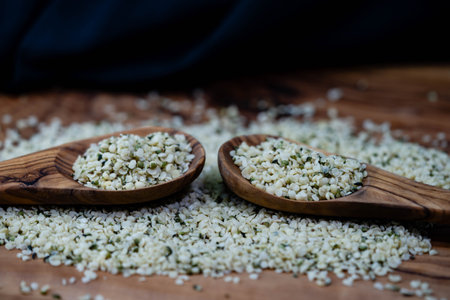 peeled hemp seeds on olive woodの写真素材
