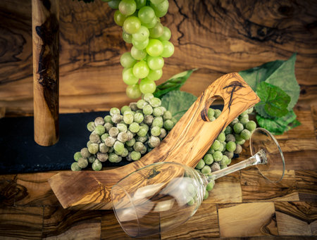 white wine grapes on olive woodの写真素材