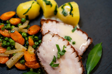 Pork Royal a traditional roast pork with vegetables and wild garlicの写真素材