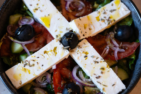 Greek salad with feta cheese, olives and hot peppersの写真素材