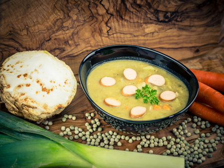 Peas Pisum sativum on olive wood for a pea soupの写真素材