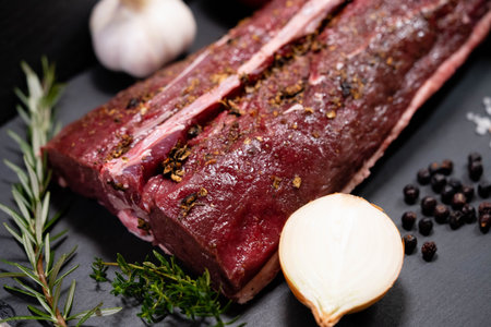 saddle of venison with herbs and spicesの写真素材