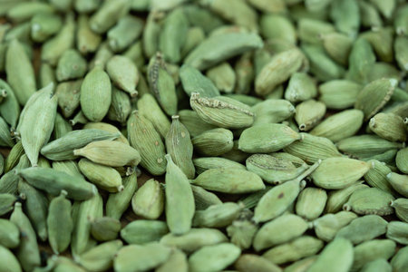 green cardamom Elettaria cardamomum on olive woodの写真素材