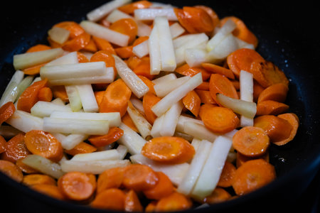 frying pan with vegetables, herbs and spicesの写真素材