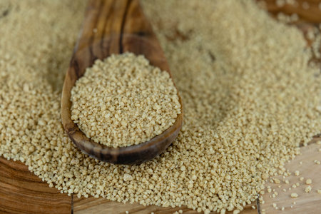 dried couscous on olive woodの写真素材