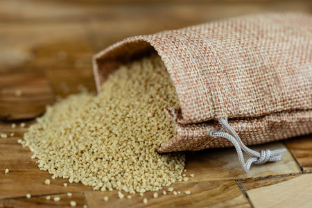 dried couscous on olive woodの写真素材