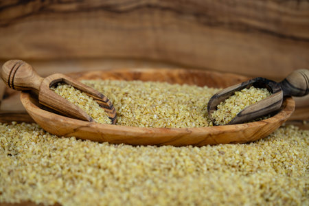 dried couscous on olive woodの写真素材