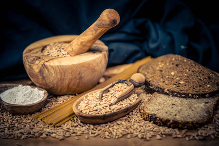 Grain and flour on olive woodの写真素材